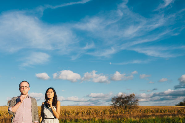 Engagement photos in an orchard, blowing bubbles. As seen on Style Me Pretty. www.rebeccachan.ca